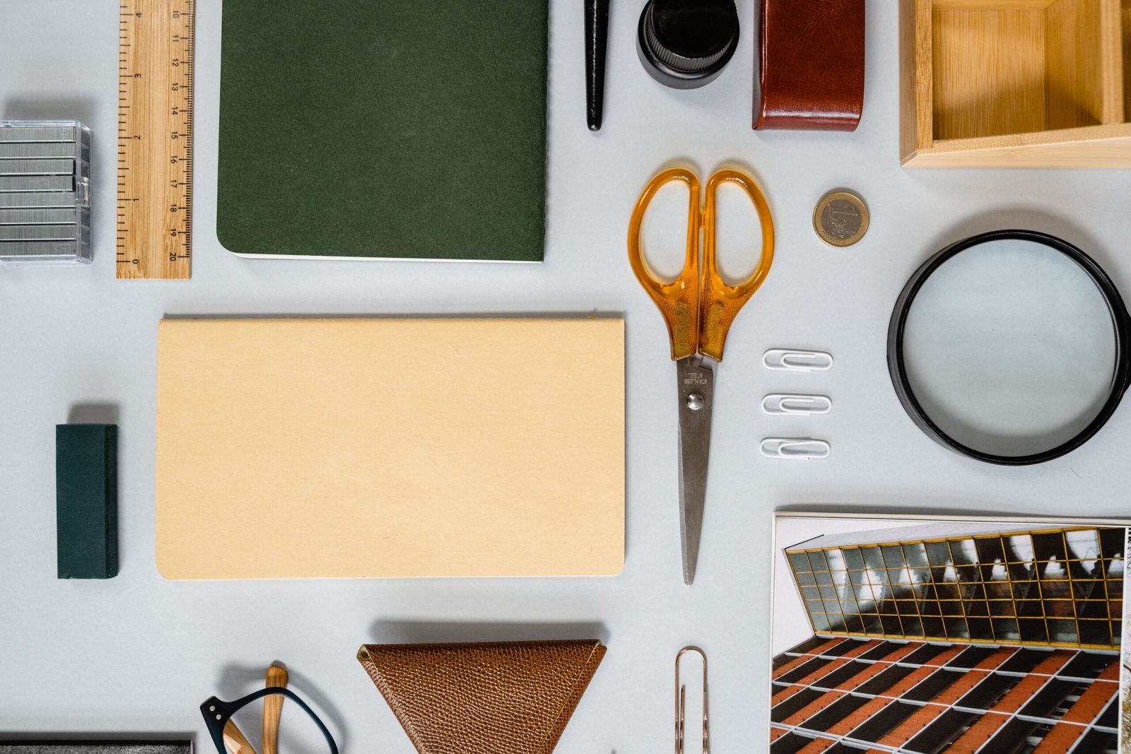 Top view of various stationery items arranged neatly on a desk, perfect for office planning themes.
